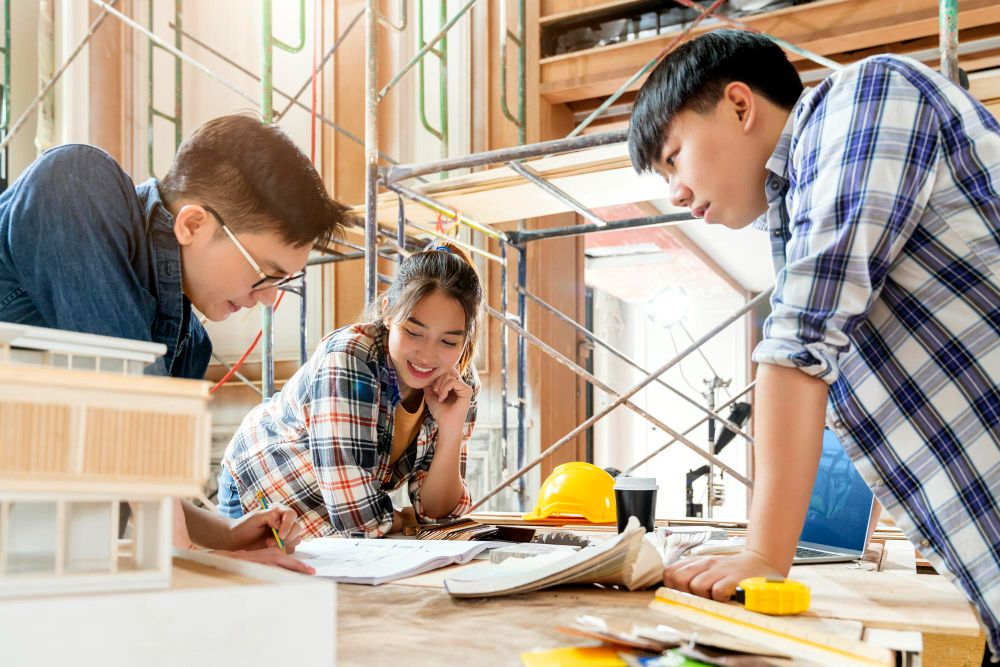 construction business owner reviewing sales pipeline with team