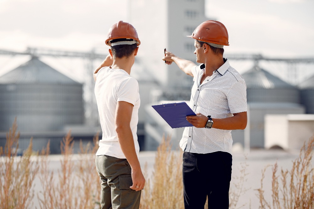 general contractor discussing construction contract with client