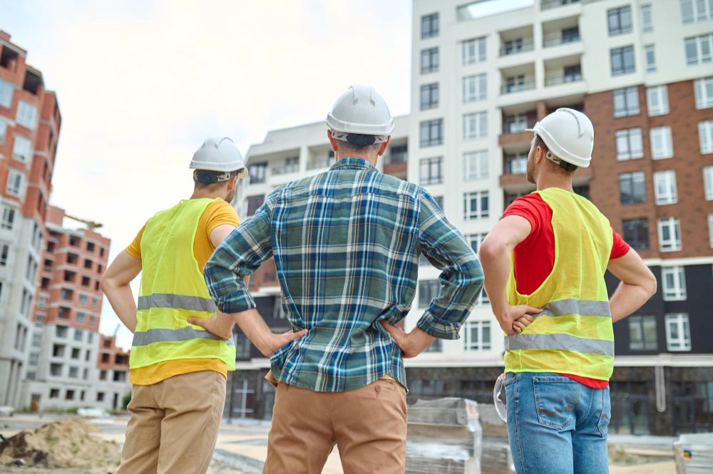 Construction workers observing progress at active job site