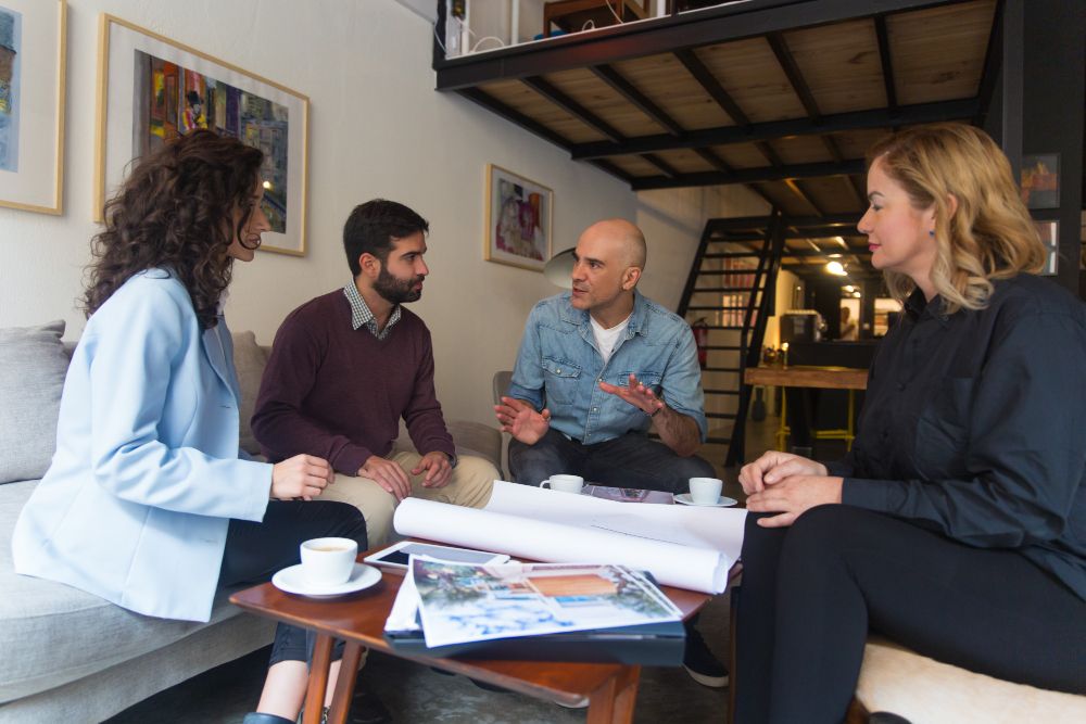 Interior designer presenting renovation plans to homeowner
