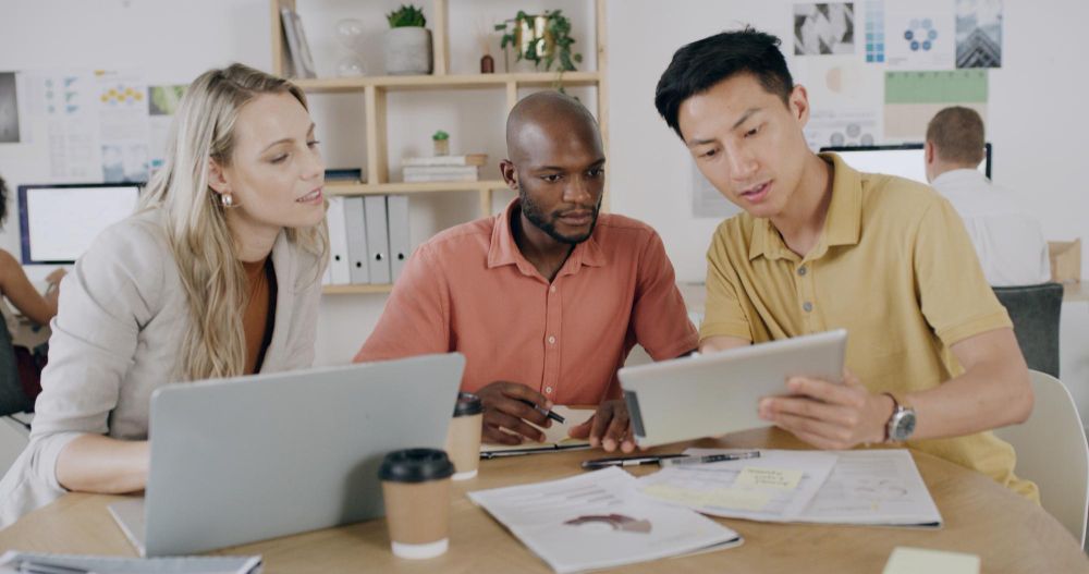 finance team reviewing invoice tracking report together