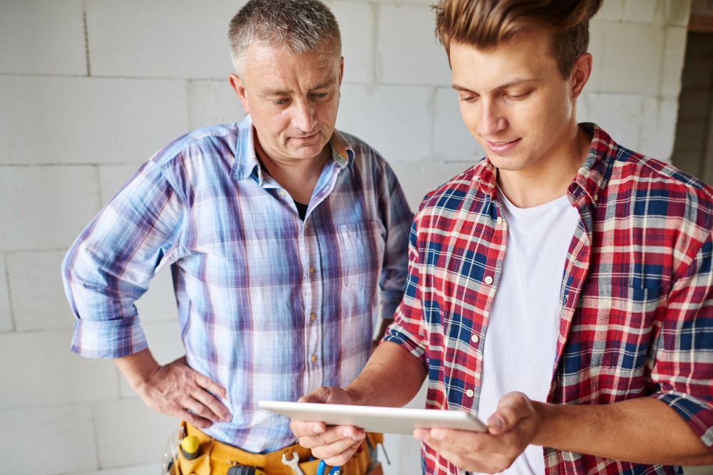 plumber reviewing detailed plumbing estimate with client