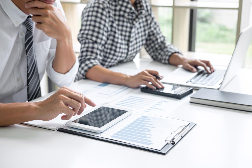 accounting team reviewing monthly report