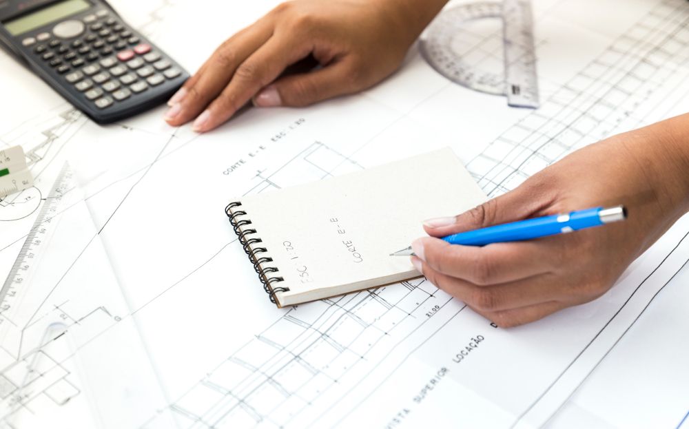 estimator calculating costs to bid on commercial electrical job