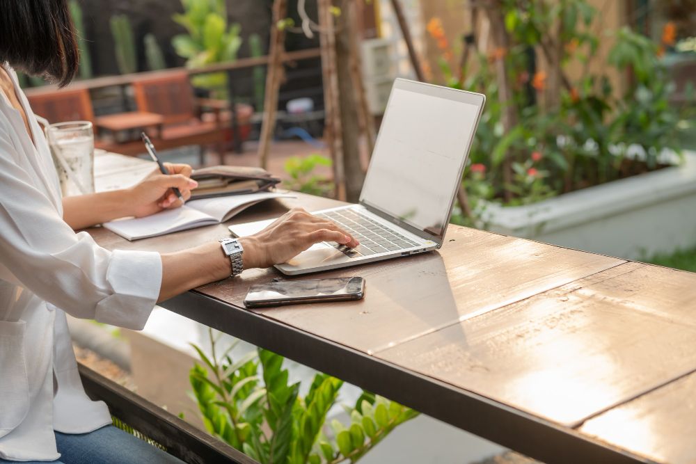 Small business owner managing appointments on a laptop