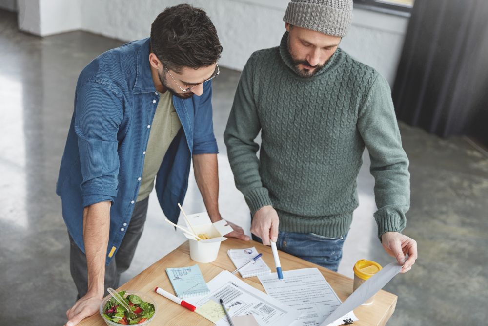 general contractor explaining project pricing to homeowner