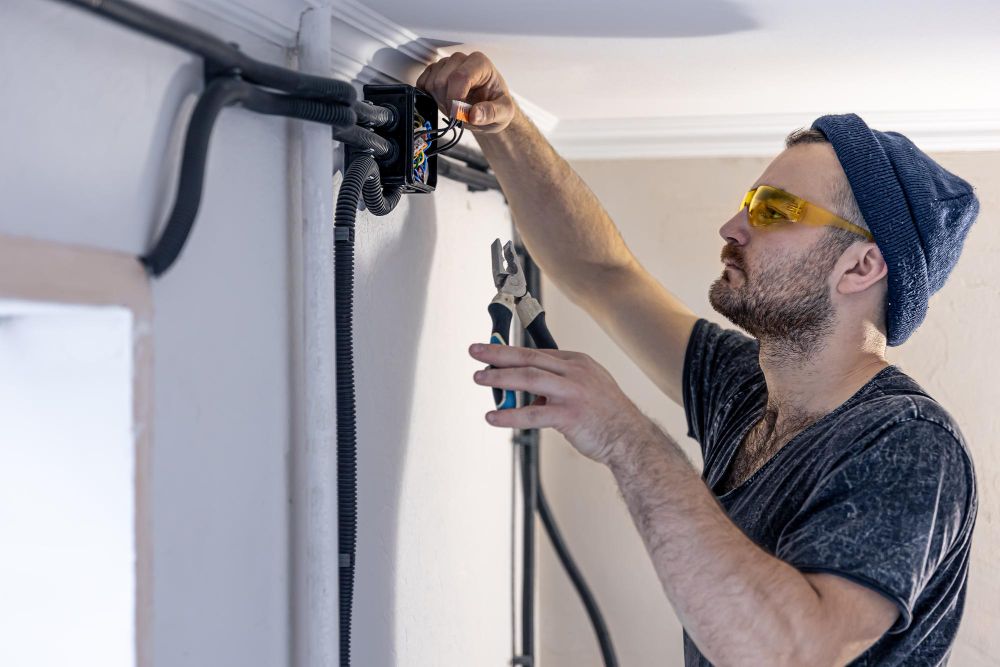 Handyman installing an electrical outlet