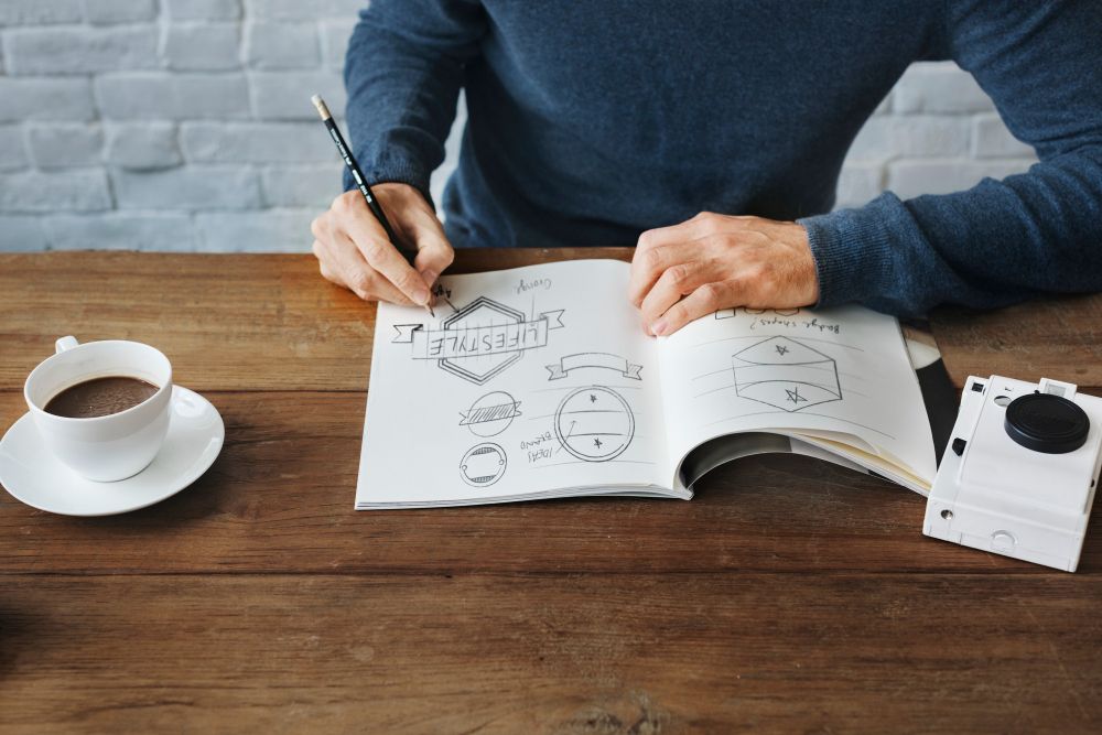house painter brainstorming creative painting company names and logo ideas