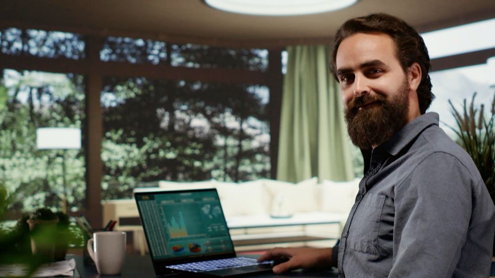 Business owner reviewing marketing performance on a laptop
