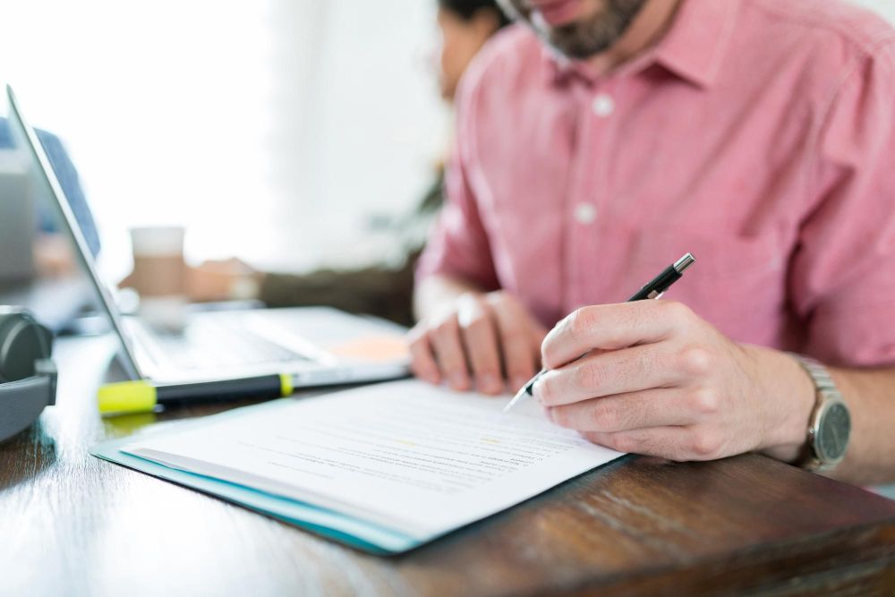 pressure washing business owner reviewing license insurance and business registration