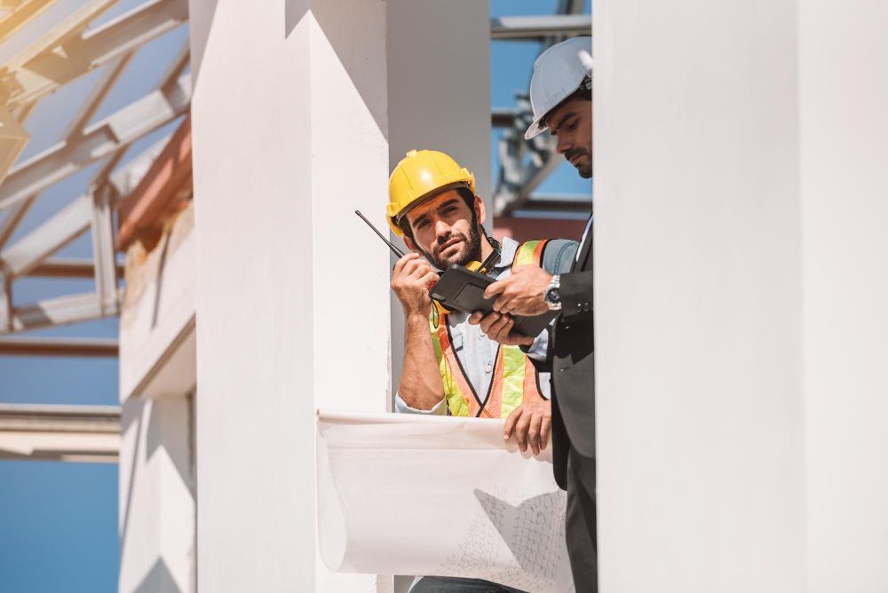 construction manager supervising workers on active job site