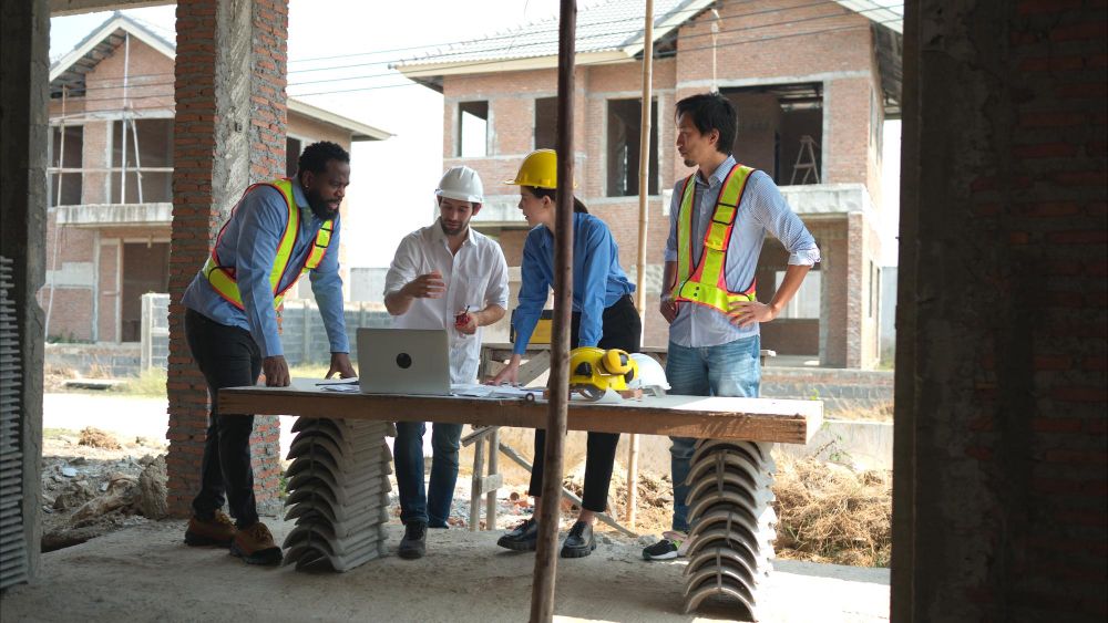 Architects and engineers assessing a residential construction project
