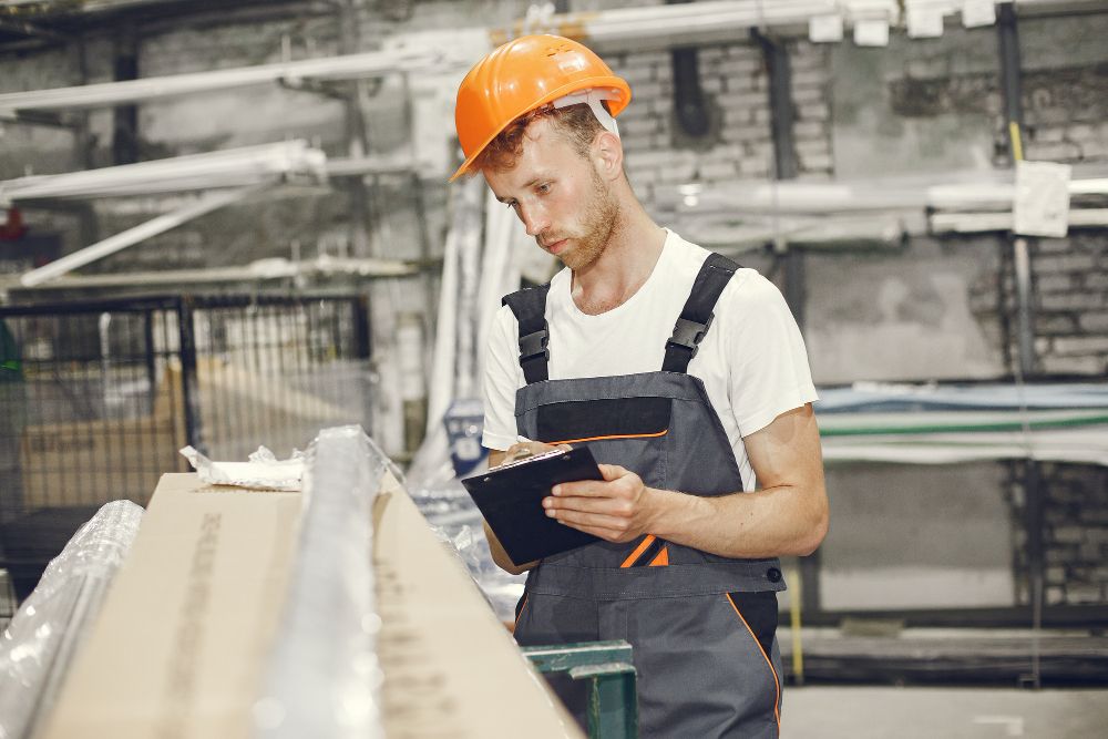 Construction technician wearing safety equipment at an industrial site