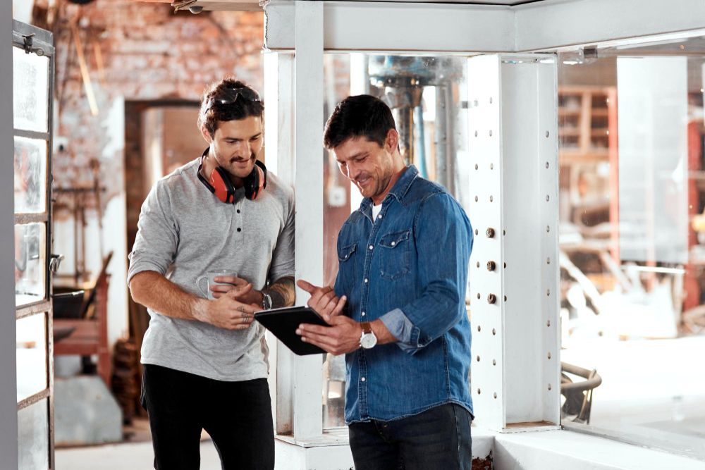 Construction team reviewing project information on a tablet