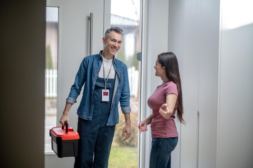Electrician arriving at a homeowner's property for a service visit