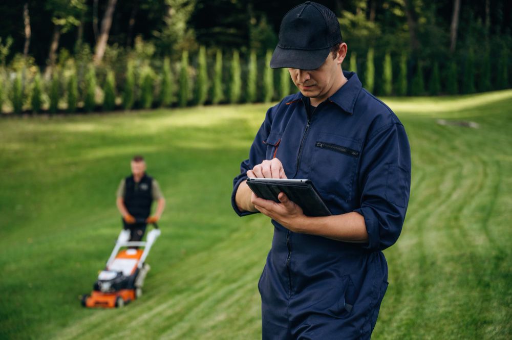 lawn care contract template displayed on laptop screen for editing