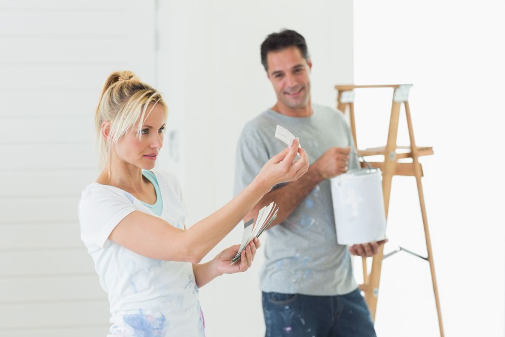 Homeowners choosing paint colors for a renovation