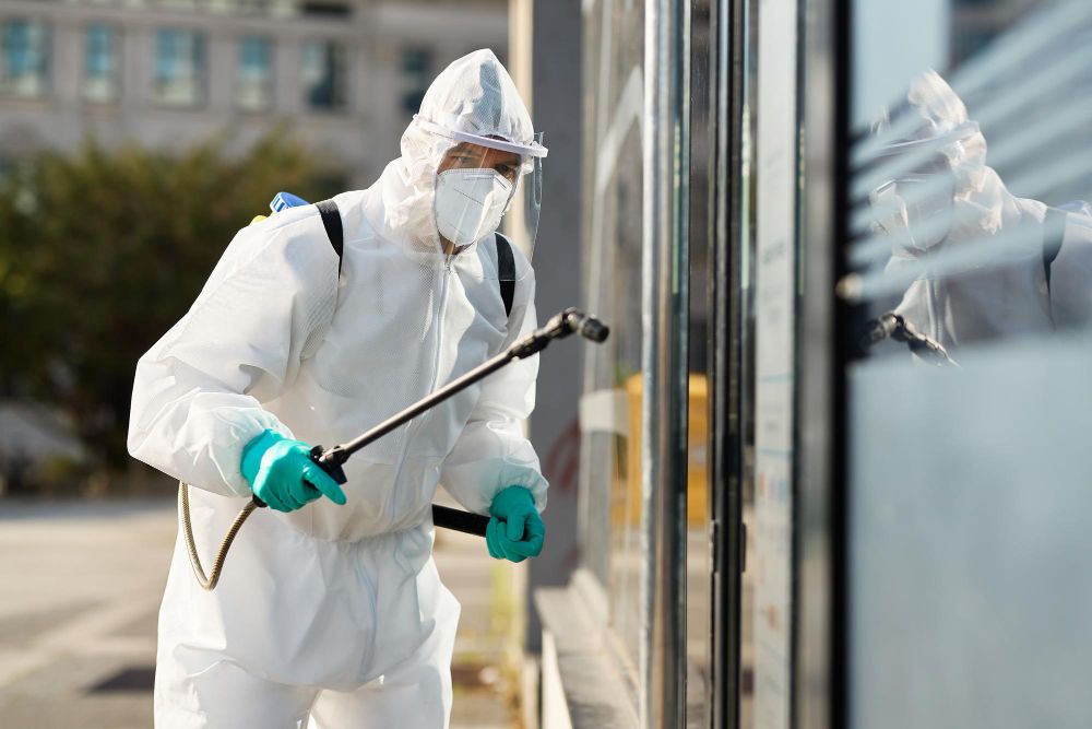 Pest control professional carrying out commercial treatment
