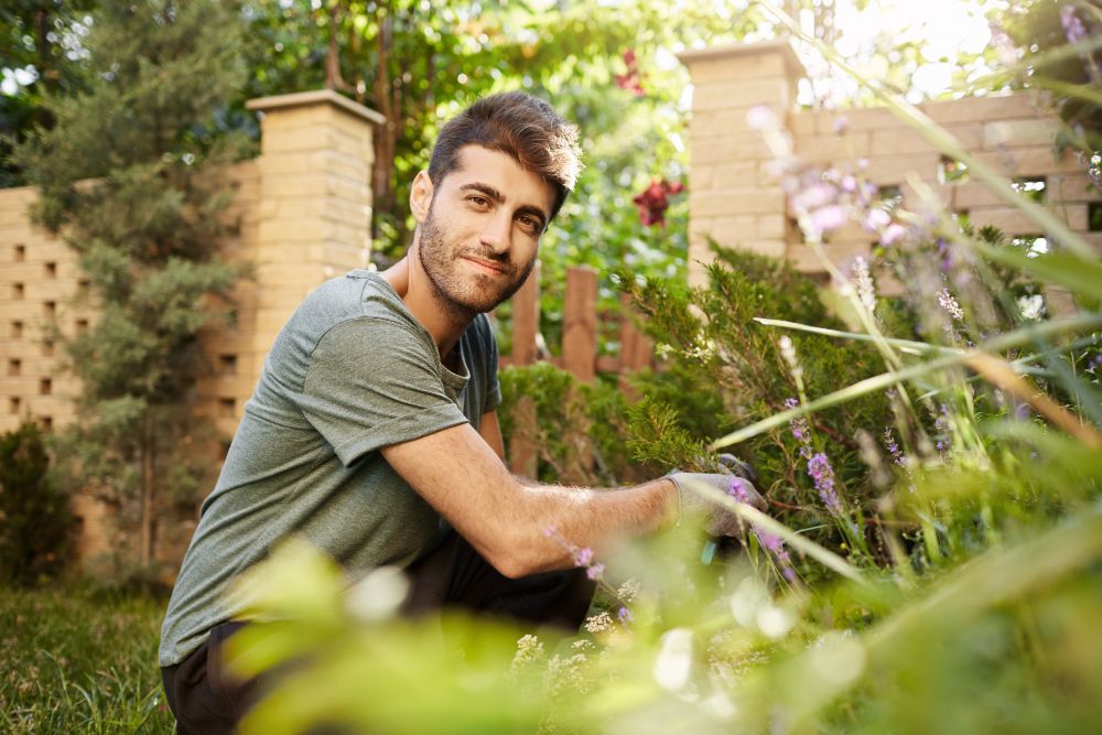 landscaper posing for picture in garden