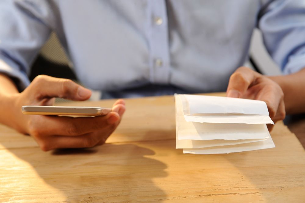 freelancer scanning a paper receipt