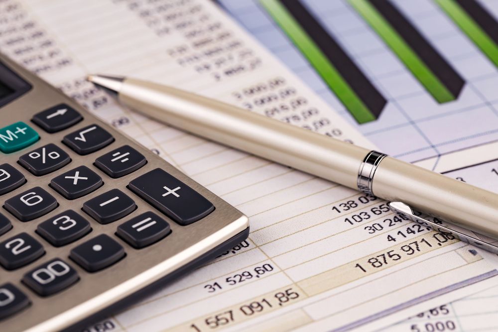 calculator and financial figures on reports