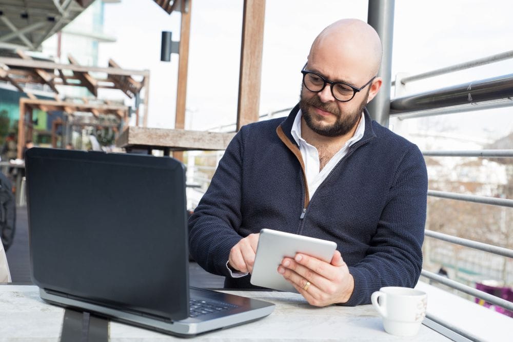Small business owner working on accounting tasks with a laptop