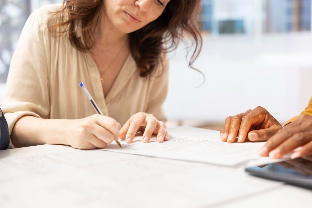professional signing a business document