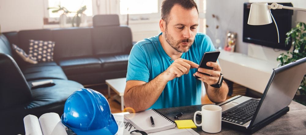Service professional using a smartphone to manage a customer transaction