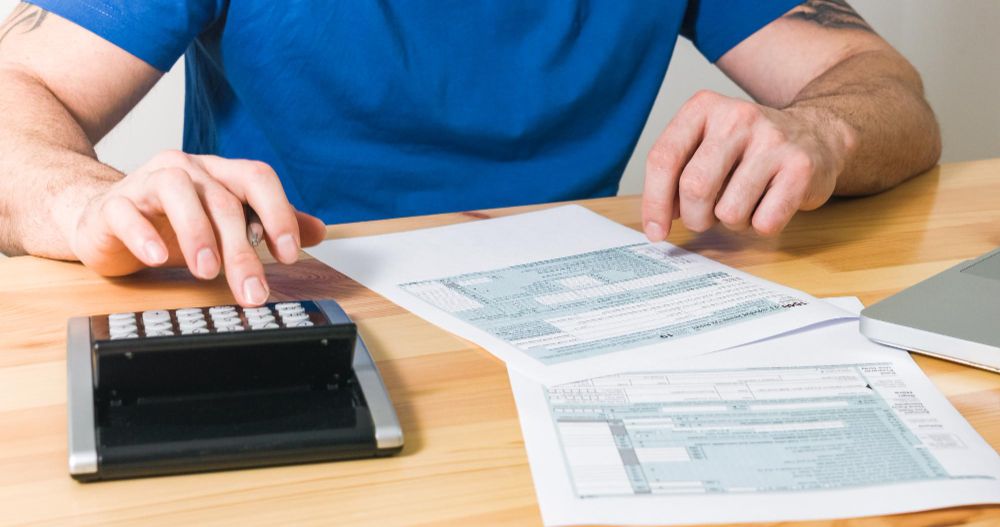 contractor calculating project costs and expenses