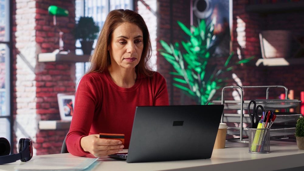 Customer using a payment card while making an online purchase