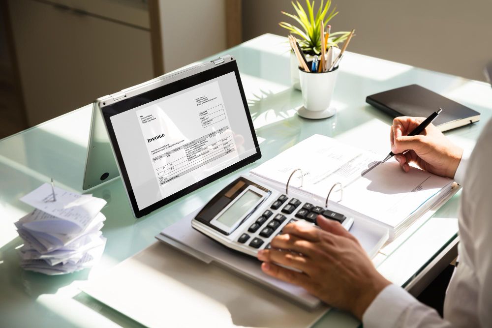 professional reviewing an invoice on tablet