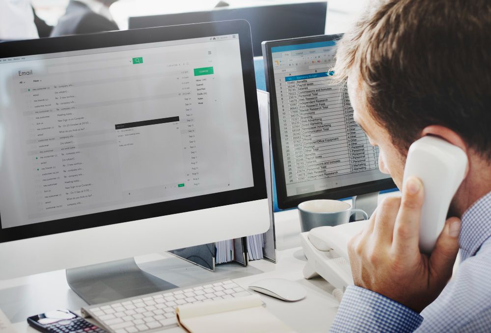 accountant managing email and spreadsheets