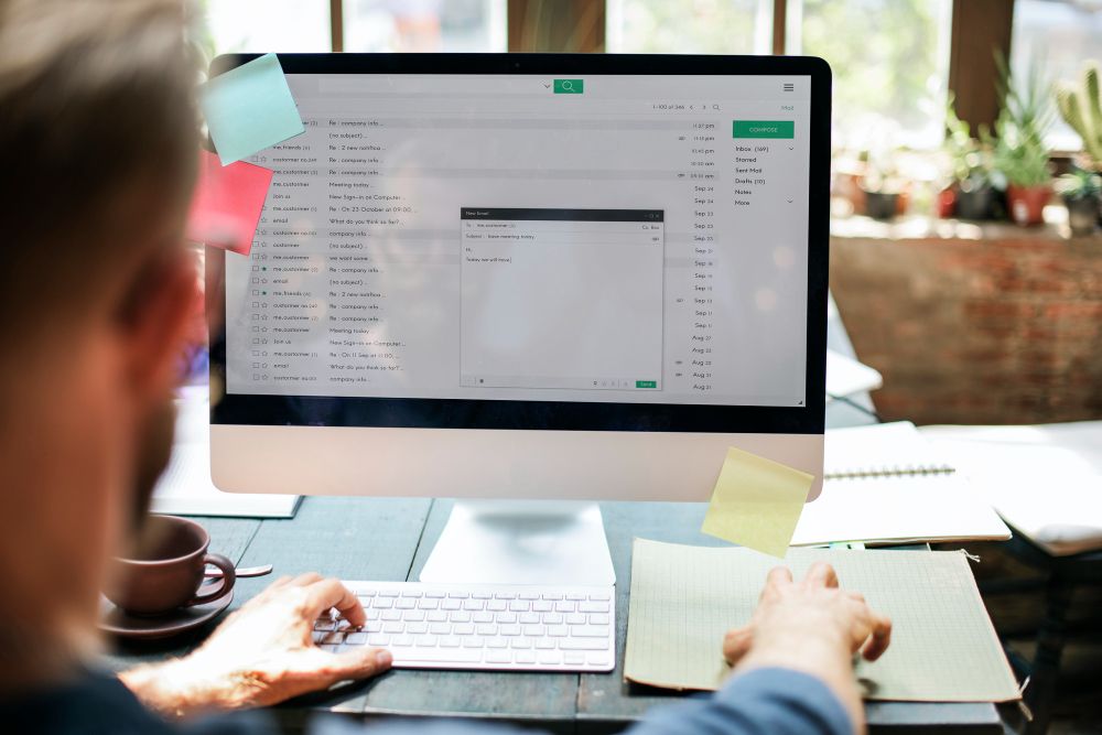 professional managing business email on desktop
