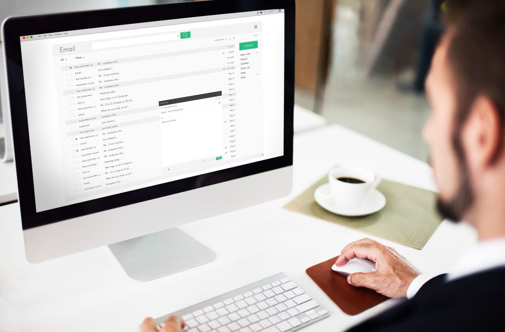 professional managing business email on desktop