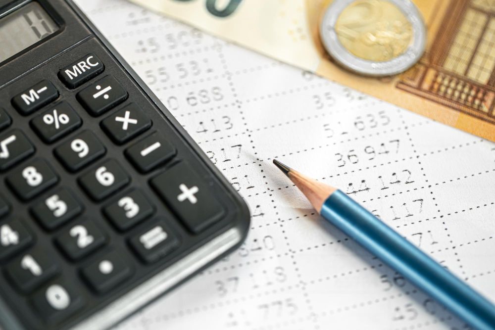 calculator and financial figures on paperwork