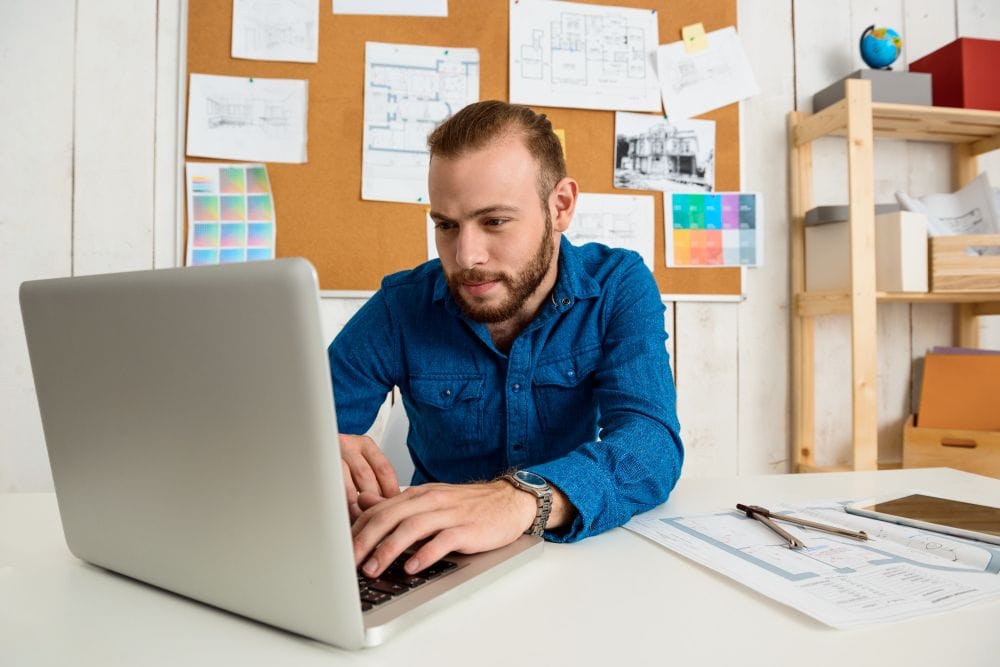 Freelancer using a laptop to manage clients and project work