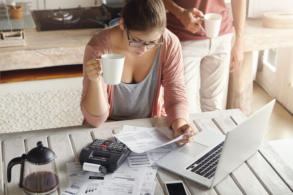 woman reviewing bills at home