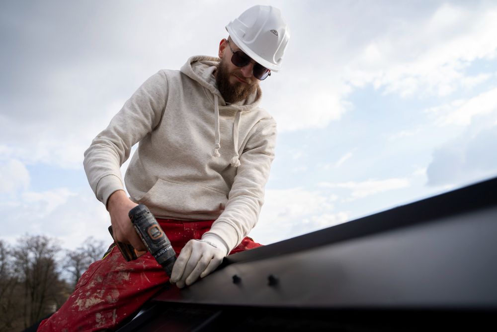 Professional roofer working in protective safety gear