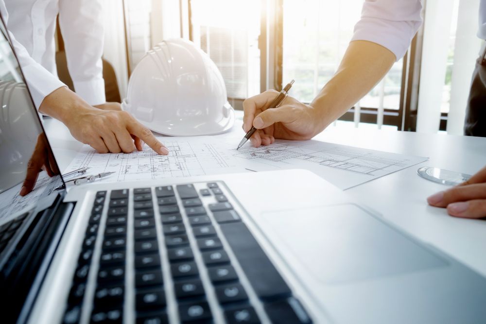 team reviewing construction blueprints and plans