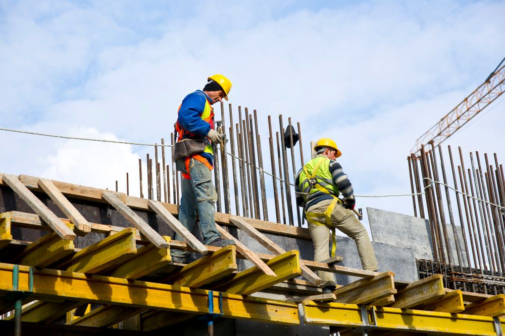Roofing crew examining work together on a job site