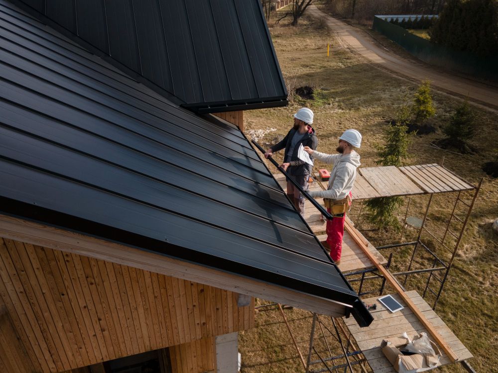 Professional roofing crew working together on a rooftop