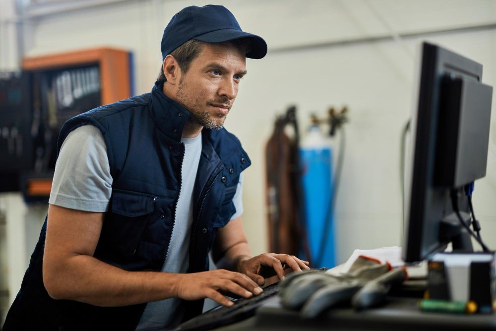 technician working at a service computer