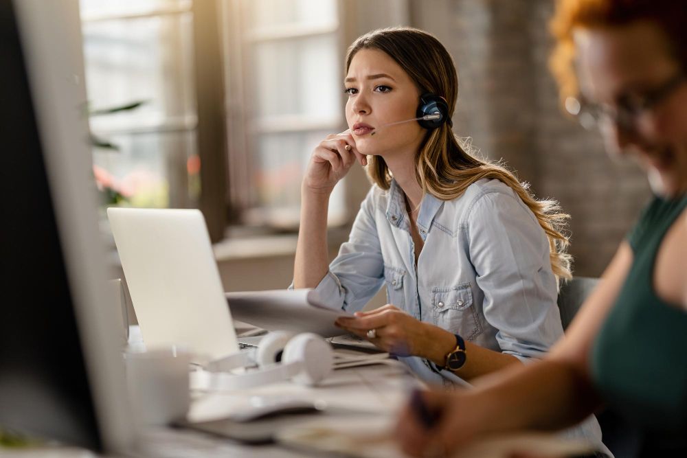 customer support agent reviewing documents