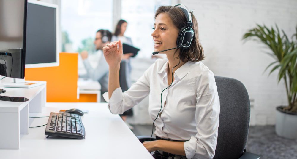 customer support agent at office desk