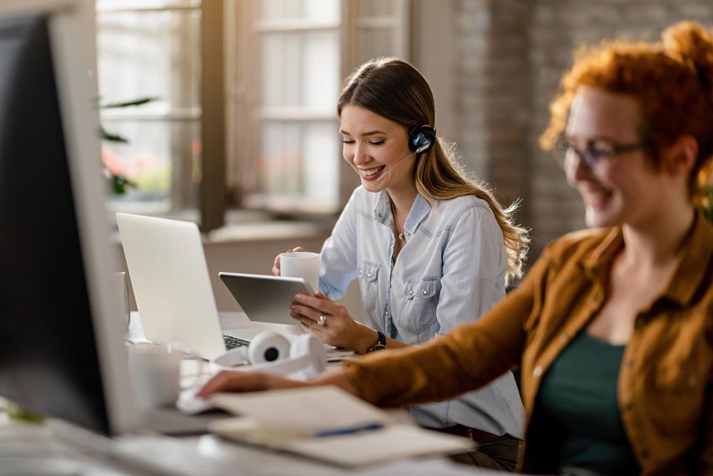 customer support team working with laptops