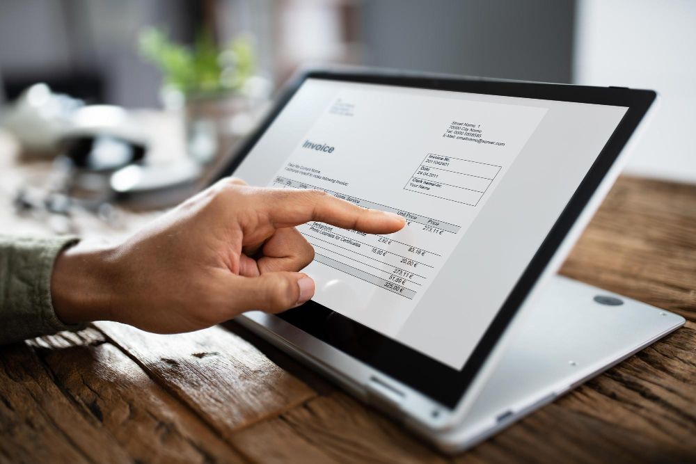 user reviewing a digital invoice on tablet
