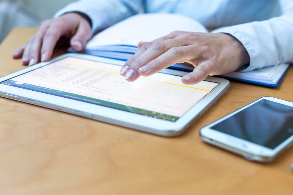professional using tablet for business invoicing